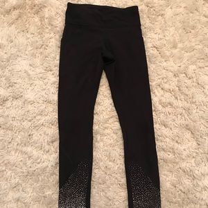 Black Lululemon cropped leggings with reflectors